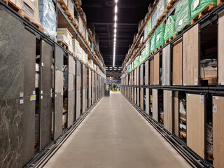Between rows of goods in a construction hypermarket