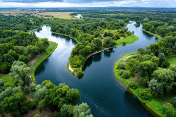 Obraz premium Winding River Through Lush Green Landscape Aerial View
