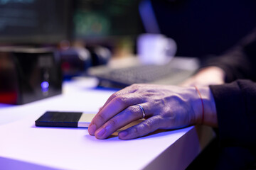 Close up of hacker holding SSD with undetectable malware used to get past antivirus protection. Cybercriminal using storage drive with data mining script software on used to breaching firewalls