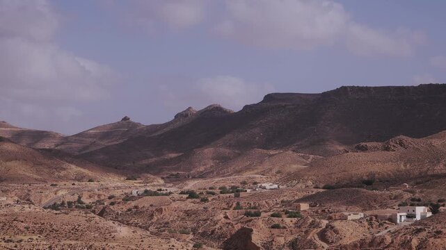 Timelapse of the clouds rolling on the rocky desert in Africa 