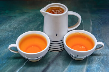 Breton cider in mugs with black stripes and a triskel, restaurant in Nice France