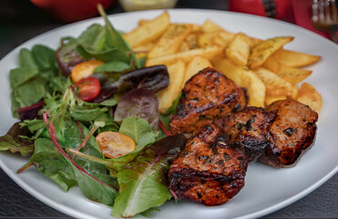 Pork shashlik, meat roasted over coals at an Armenian restaurant in Nice, France