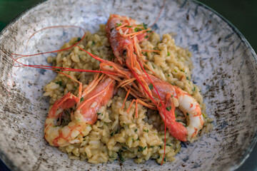 Lobster bisque risotto with whole shrimp at a restaurant, Nice, South of France