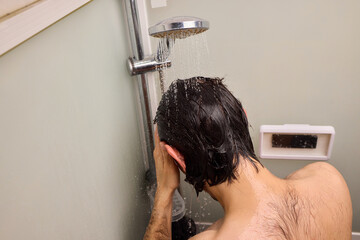 Naklejka premium Personal hygiene routine, Cleaning and relaxing shower time, Individual cleansing session in steamy bathroom, Relaxing personal grooming amidst humid shower environment