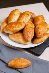 Golden Homemade Filled Pastries or Buns In Plate, Top View