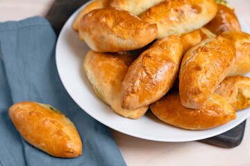 Close-Up of Baked Stuffed Golden Pastries on Plate