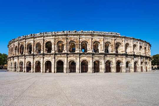 Nîmes arena, wide angle view of the ruins of the roman amphitheater in Nîmes, Provence, France; ancient roman ruins