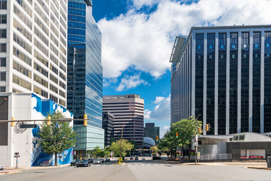  Commercial district in Arlington Virginia showing glass architecture and traffic movement - Powered by Adobe