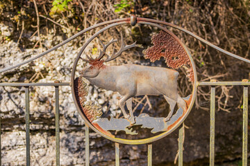 Close up shot of a cute metal animal shape signage on the bridge