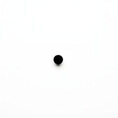 A minimalist black dot centered on a white background creating a simple and clean visual composition with a focus on contrast and balance