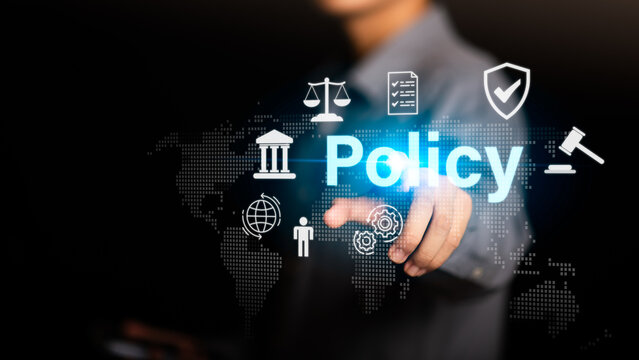 A businessman touching a digital interface with the word POLICY and legal icons, symbolizing corporate regulation, compliance governance, business management, and global law in the digital era.
