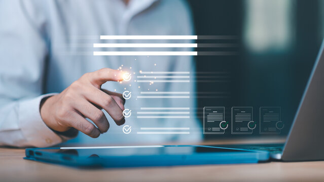 A businessman using a digital interface to check tasks on a virtual checklist, symbolizing workflow management, document approval, and business process automation in modern corporate systems.