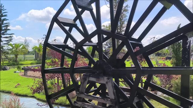 A wooden baler is in the garden