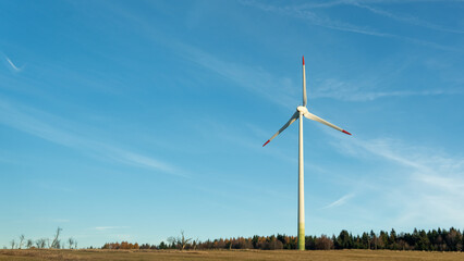 Fototapeta premium Wind Turbine on Field with Blue Sky