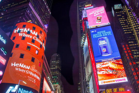 Times Square with its billboards at night in Midtown Manhattan,  New York City, USA