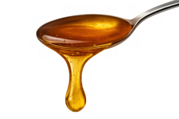 Honey dripping from a spoon, a sweet golden syrup flowing, food ingredient on transparent background