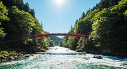 Lush valley with red bridge spanning a rushing river