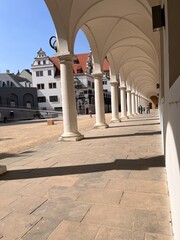 Obraz premium Classical colonnade architecture with arches and pillars