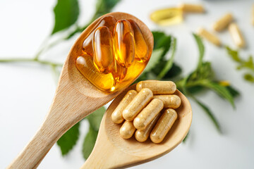 Alternative medicine herbal organic capsule vitamin E omega 3 fish oil drug herbs leaf natural