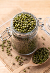 Mung bean in glass jar and spoon, Asian food ingredient
