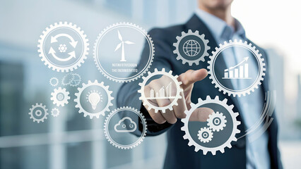 Businessman pointing at holographic gear icon surrounded by sustainability symbols including recycling wind turbine globe graph cloud in futuristic office with blurred cityscape windows
