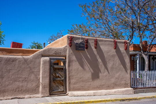 Santa Fe, NM, USA - May 15, 2025: Angled View of Ristras at Las Palomas, a Section of Los Palomas Bed and Breakfast on West San Francisco Street