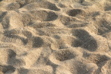 Beach sand texture background at the sea.