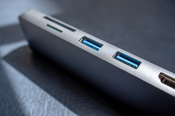 Photograph of a USB hub with a set of computer inputs, focusing on USB Type-A.