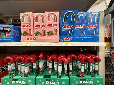 A festive retail shelf display featuring Jell-O candy canes and Hershey&rsquo;s Kisses holiday packaging, photographed in a grocery store in Calgary, Alberta, Canada.