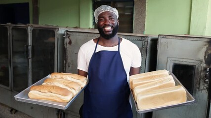 Local African baker entrepreneur, small business owner, proudly holds trays of freshly baked bread, showcasing his successful SME - Powered by Adobe