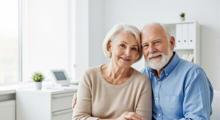 Senior couple at home &mdash; happy elderly pair embracing, smiling together, lifestyle and healthcare concept