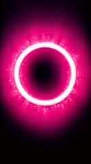 A bright, luminous pink ring emanates a magical glow, surrounded by tiny, shimmering particles against a deep black backdrop.