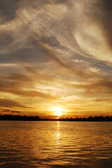 Obraz premium Vertical Horizon Tropical amazing dramatic golden sky on sunset scenic river lake seascape ocean. Vertical Silhouette tranquil season serene landscape. Tranquil lake countryside river reflection