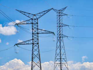 Pair of 220kv high voltage towers installed in high Andean mountains undergoing maintenance