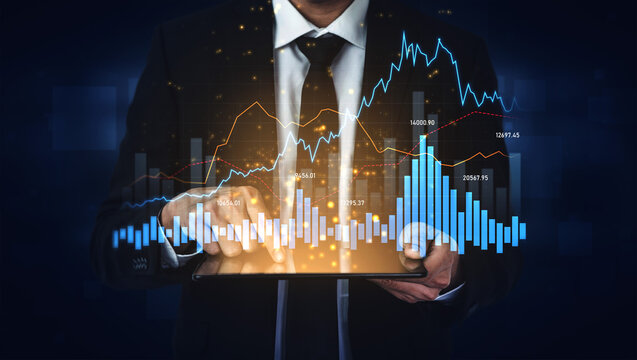 A businessman uses a tablet to analyze financial data, displaying stock market graphics and charts, representing trends and investment opportunities in the modern digital world. Scalp