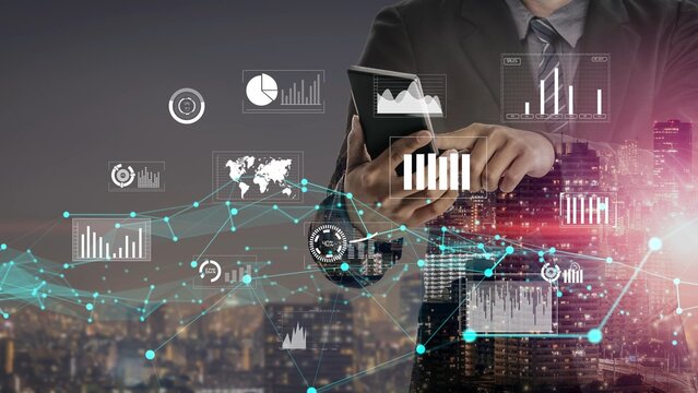 A business professional stands against a city skyline, analyzing data on a tablet. Digital graphs and charts surround them, illustrating trends in analytics and growth. Xenic