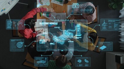 A diverse group of professionals collaborates on electric vehicle technology in a modern workspace, using digital tools and interfaces to visualize data and concepts. Raster