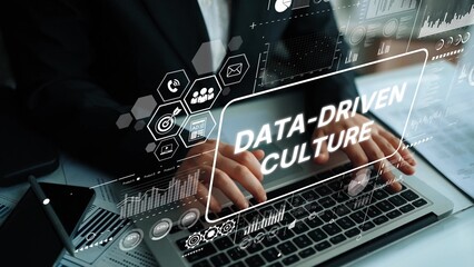 Hands Typing on Laptop with Overlay of Data-Driven Culture Concepts and Graphical Elements in Modern Office Setting. Asymptotic smart data analytic.