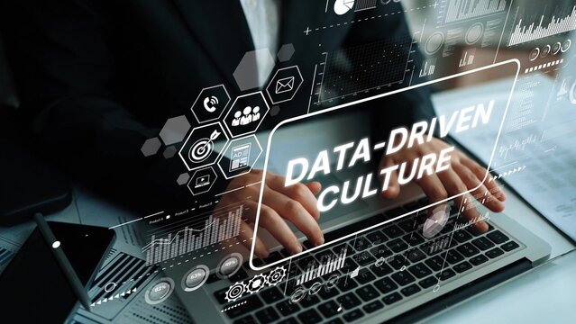 Hands Typing on Laptop with Overlay of Data-Driven Culture Concepts and Graphical Elements in Modern Office Setting. Asymptotic smart data analytic. - Powered by Adobe