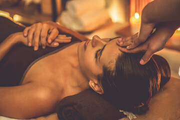 Caucasian woman enjoying relaxing anti-stress head massage and pampering facial beauty skin...