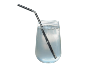 Refreshing clear cold drink in a glass with a bent striped straw