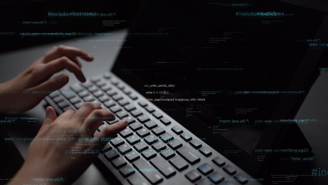 A close-up image of hands typing on a sleek computer keyboard, surrounded by dynamic data visuals, representing the essence of modern technology and programming. Xenic - Powered by Adobe