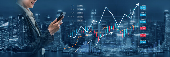 A business professional engages with a smartphone to track stock market trends amidst an illuminated urban skyline, accompanied by financial graphs and data imagery. Scalp