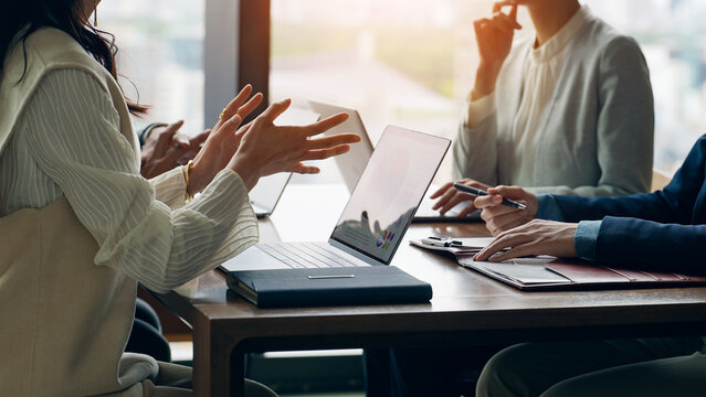 Group of casual business people meeting in an office