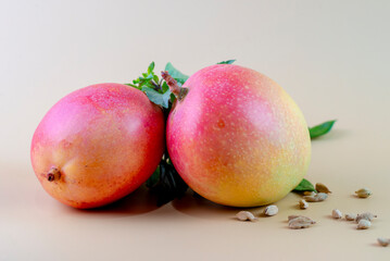 Closeup of mangoes on a yellow background
