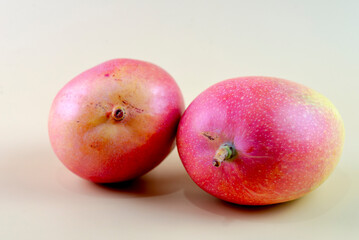 Closeup of mangoes on a yellow background