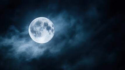 Dramatic full moon in clear night sky, high-telephoto detail showing crater texture and maria