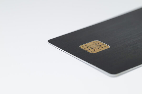 Close up of a black smart card with ic chip on white background