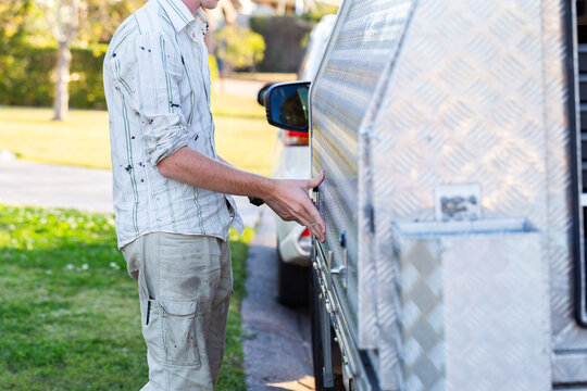 young man closing side of tradie handyman ute