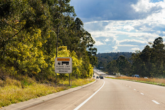 Reduce noise please limit compression breaking sign for trucks on highway coming into Singleton